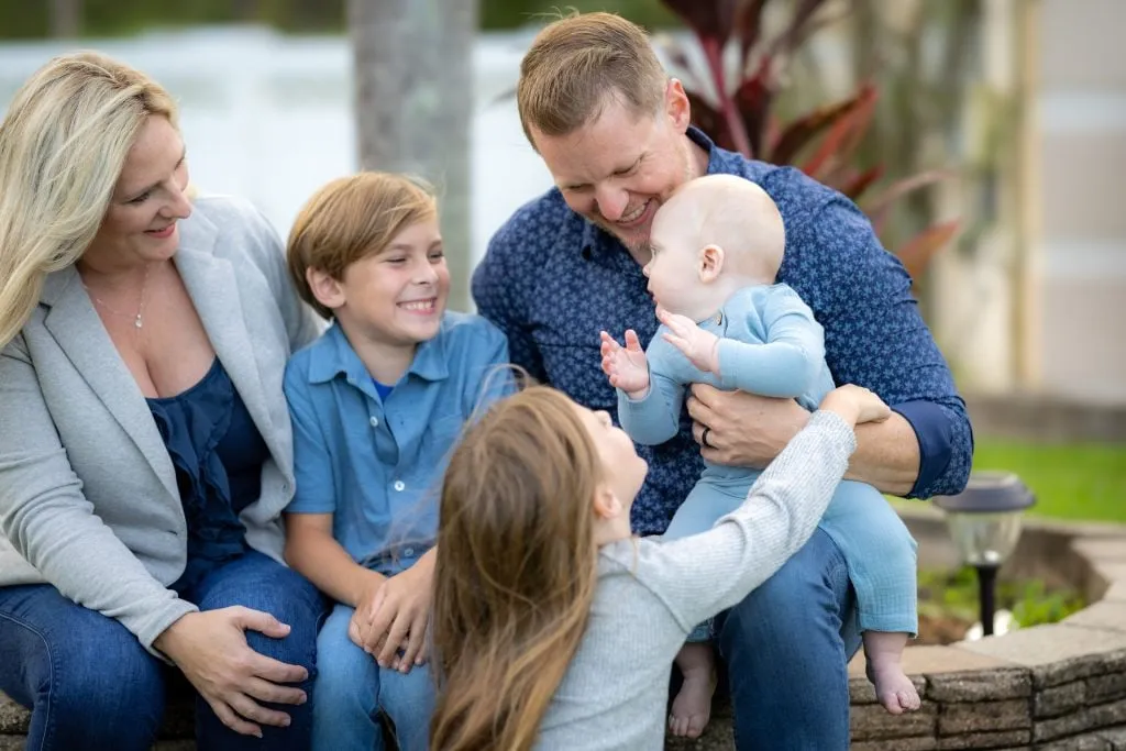 Family smiling together outdoors
